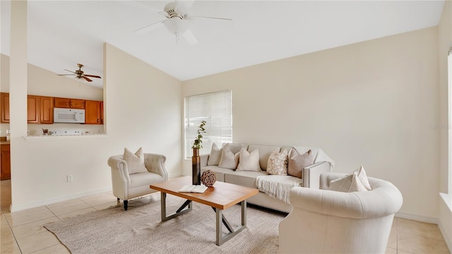 living room with light tile patterned floors, baseboards, lofted ceiling, and a ceiling fan