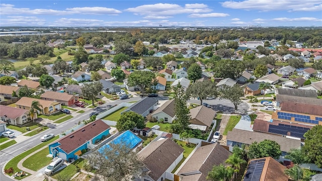 birds eye view of property with a residential view