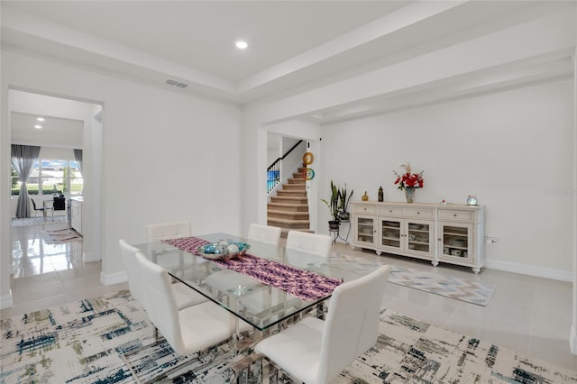 dining area featuring light tile patterned floors