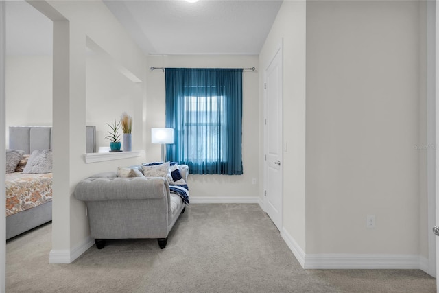 bedroom featuring light carpet