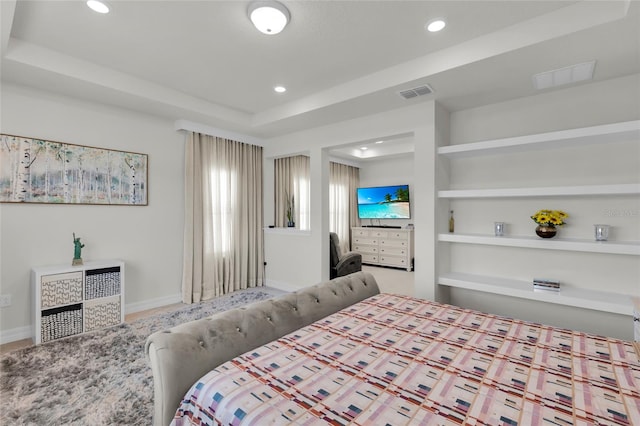 bedroom featuring a raised ceiling