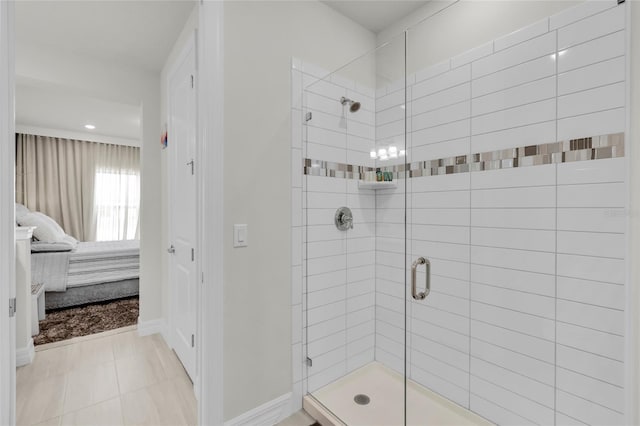 bathroom with a shower with door