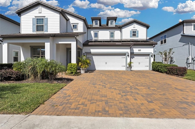 view of front of property with a garage