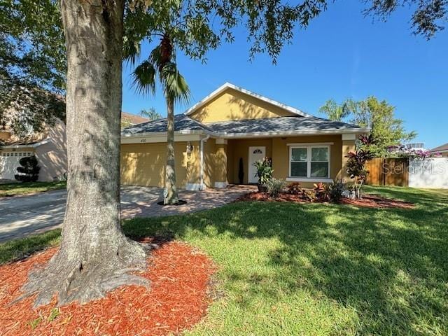 ranch-style home with a front lawn