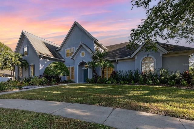 view of front of property with a yard