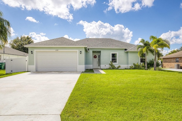 ranch-style home with a front lawn, central AC unit, and a garage