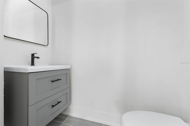 bathroom featuring vanity and toilet