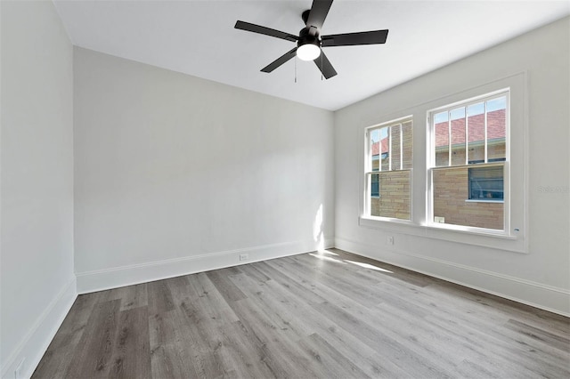 spare room featuring ceiling fan and light wood-type flooring