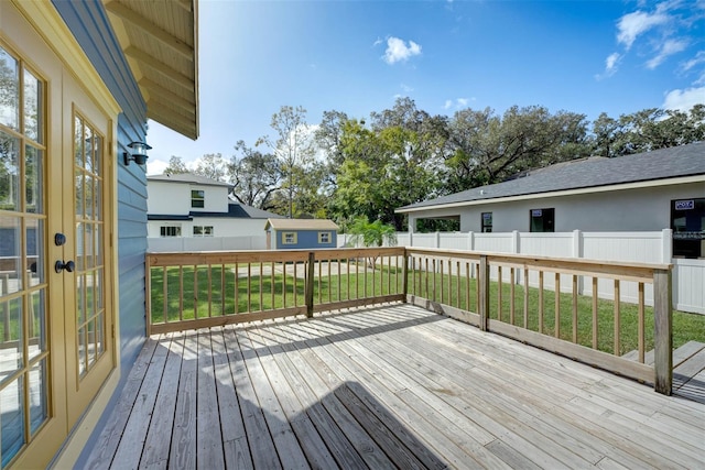 wooden terrace with a yard