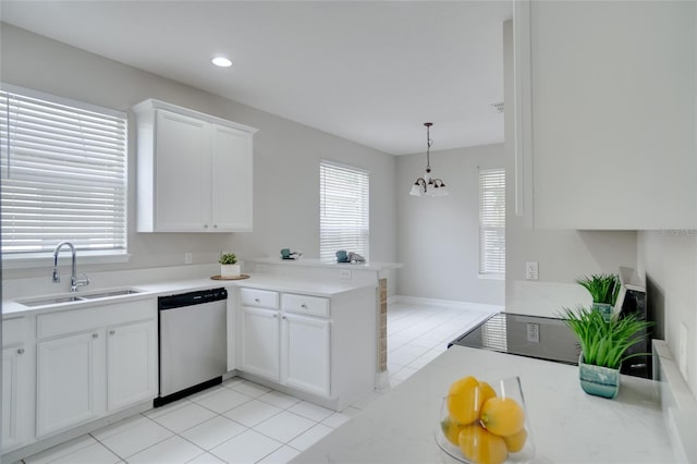 kitchen with a peninsula, light tile patterned flooring, light countertops, a sink, and dishwasher