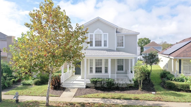 view of front property featuring covered porch