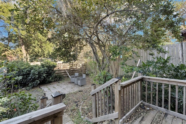 wooden terrace with a patio