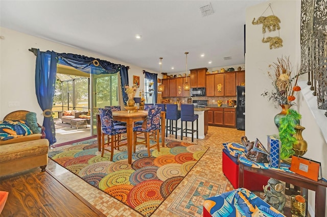 dining room with light hardwood / wood-style floors