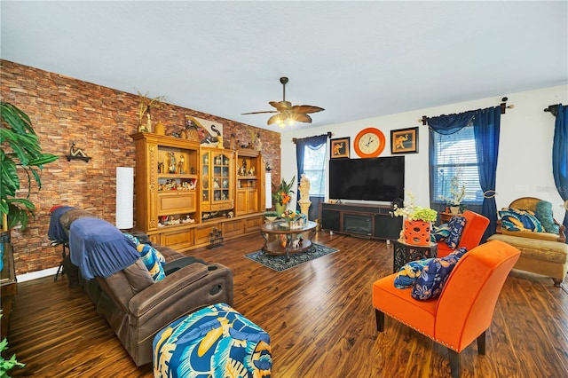 living room with a wealth of natural light, ceiling fan, and dark hardwood / wood-style flooring