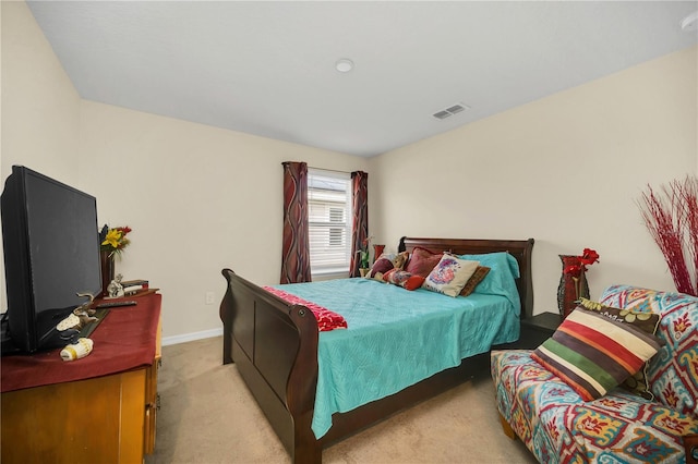 bedroom featuring light colored carpet