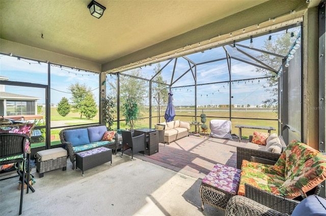 view of patio / terrace featuring an outdoor living space and a lanai