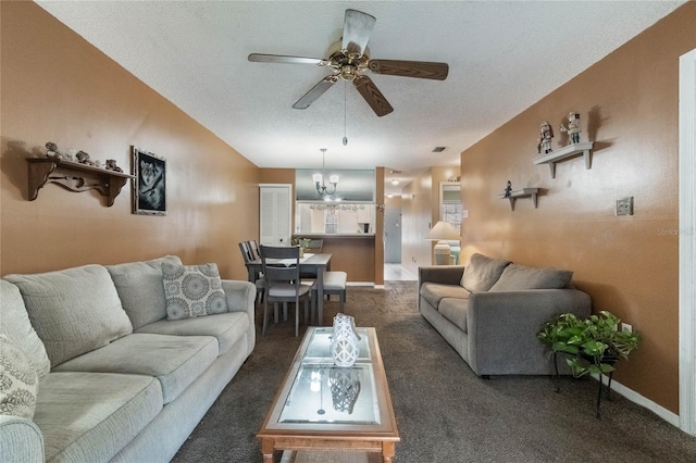 living room featuring a textured ceiling, ceiling fan with notable chandelier, and dark colored carpet