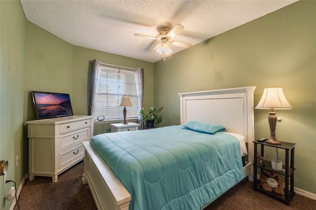 carpeted bedroom featuring a textured ceiling and ceiling fan