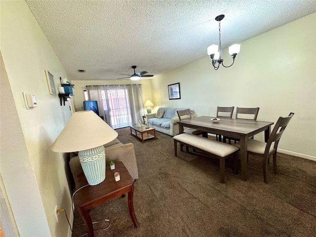 carpeted dining room featuring visible vents, a textured ceiling, baseboards, and ceiling fan with notable chandelier