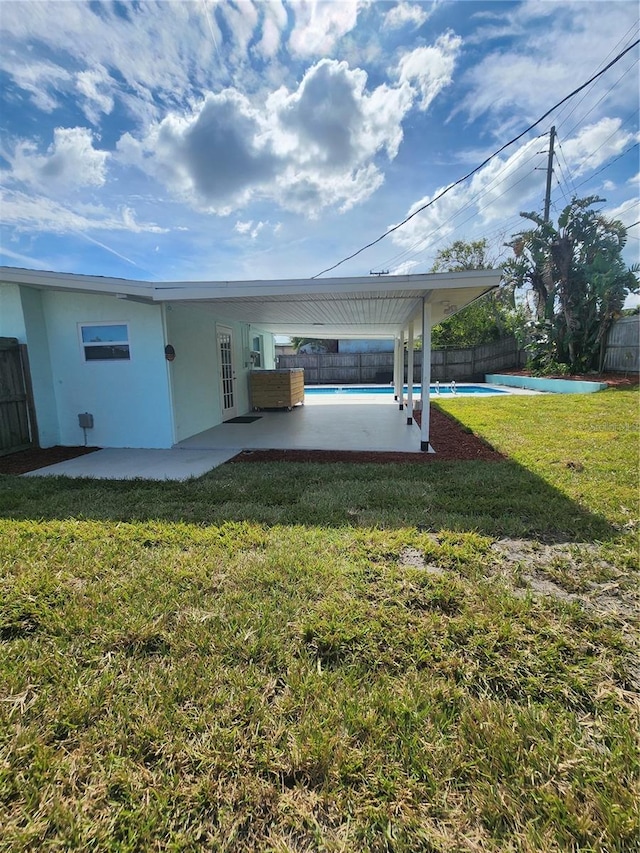 exterior space featuring a fenced in pool and a patio