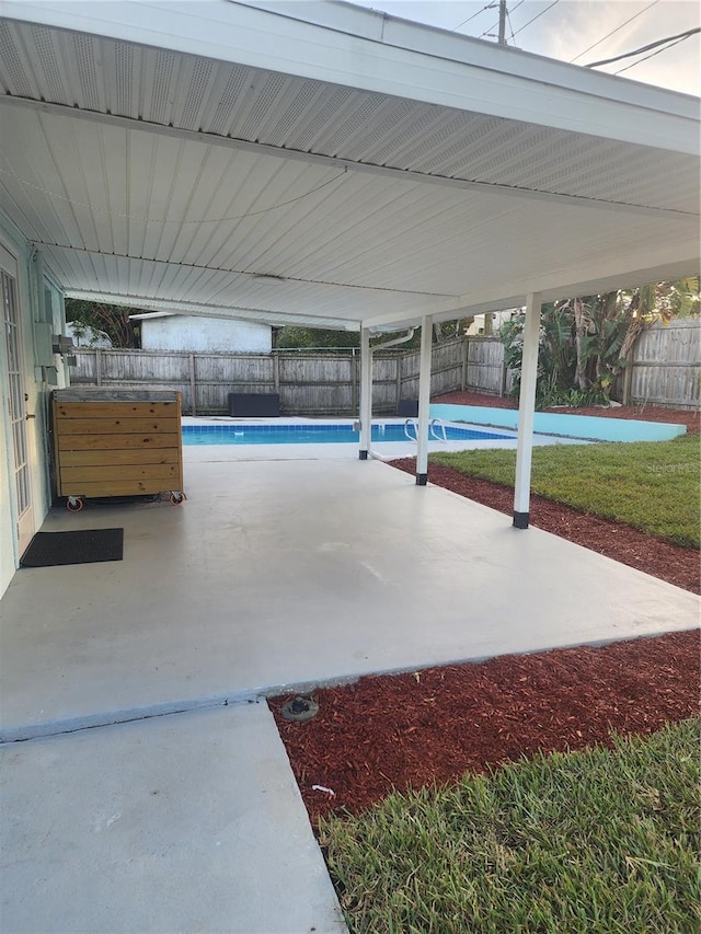 view of patio / terrace featuring a fenced in pool