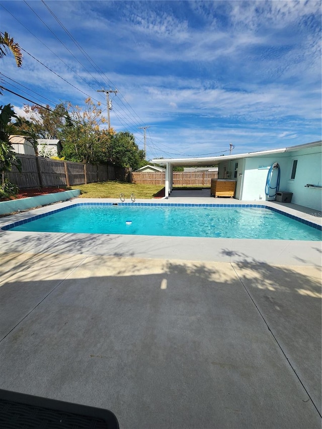 view of swimming pool with a patio