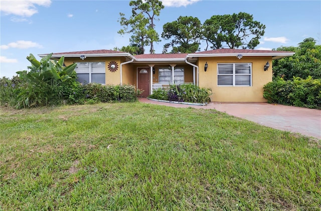 ranch-style house with a front lawn