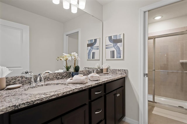 bathroom with vanity, tile patterned floors, and walk in shower