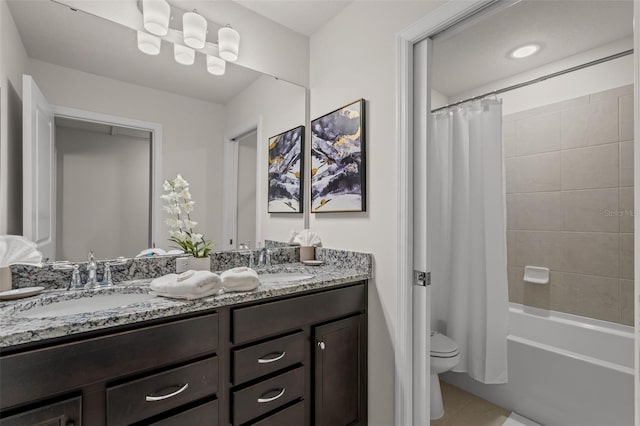 full bathroom featuring toilet, vanity, and shower / bath combination with curtain