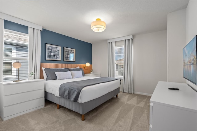 carpeted bedroom featuring a textured ceiling