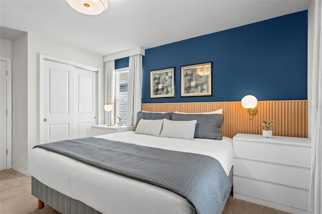 carpeted bedroom featuring a closet