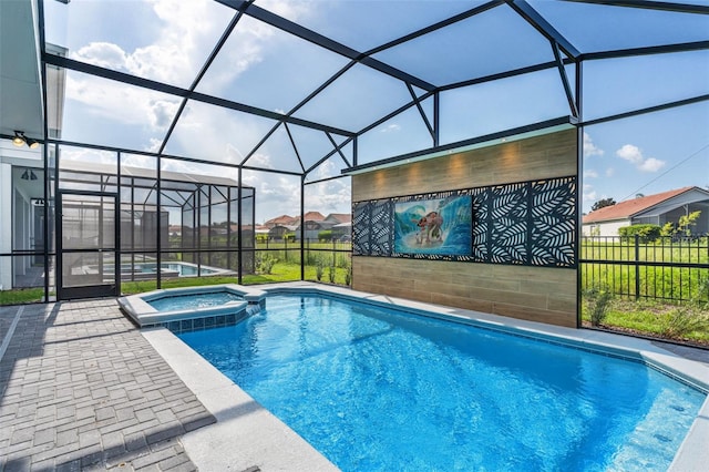 view of pool with an in ground hot tub and a lanai