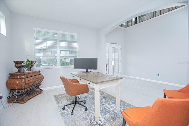 office space with hardwood / wood-style floors