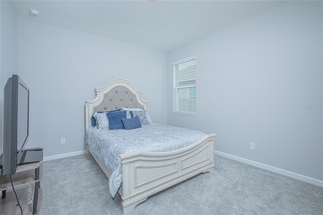 bedroom with light colored carpet