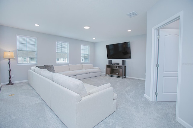 living room featuring light carpet