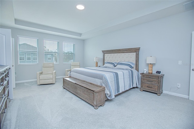 bedroom featuring light carpet