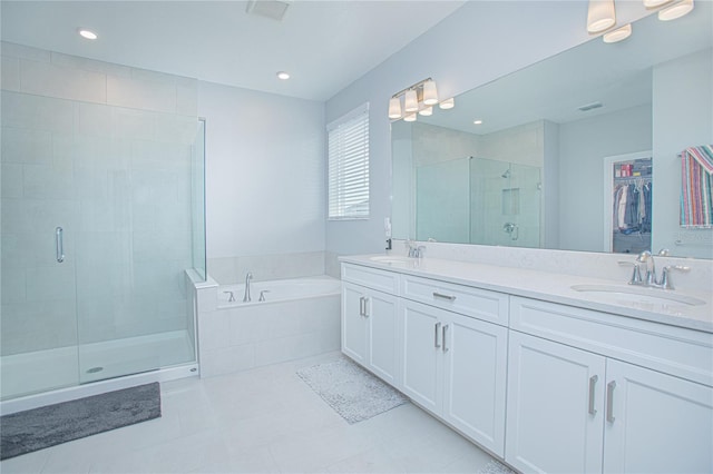 bathroom with vanity, tile patterned floors, and separate shower and tub