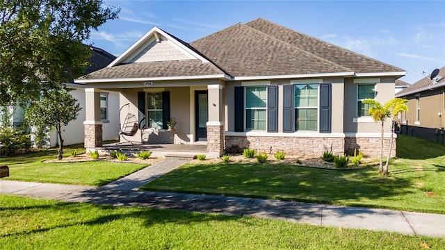 view of front of house with a porch and a front lawn