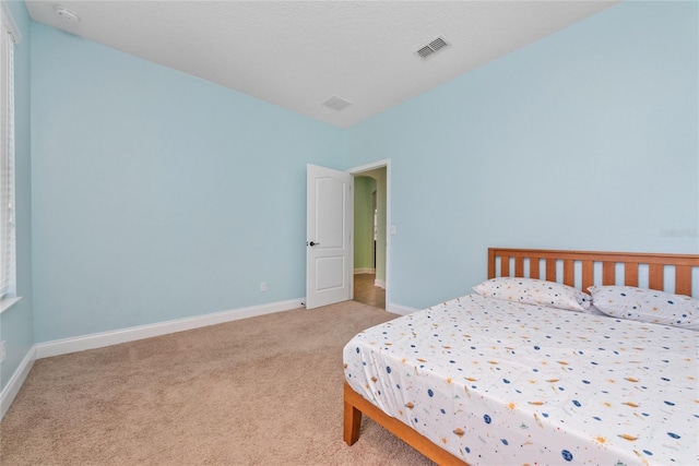 bedroom with light carpet