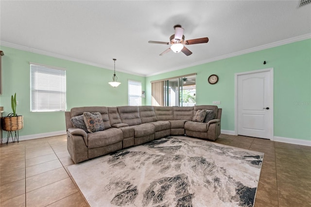 tiled living room with a wealth of natural light, ornamental molding, and ceiling fan