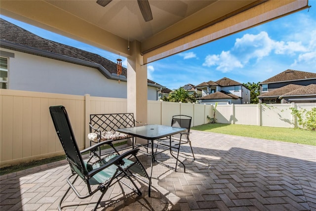 view of patio featuring ceiling fan