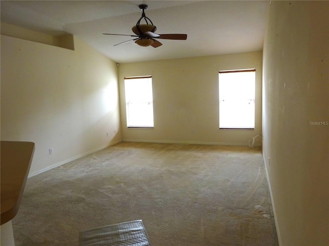 721 Willow Run St, Minneola, FL 34715 - spare room with light carpet, ceiling fan, and baseboards