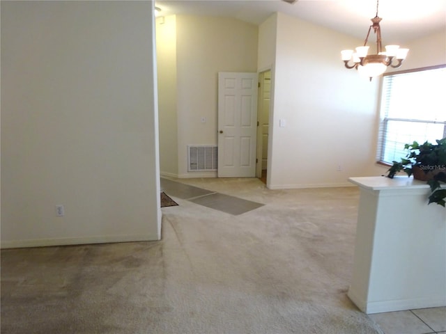 721 Willow Run St, Minneola, FL 34715 - spare room with a chandelier, vaulted ceiling, light colored carpet, and baseboards