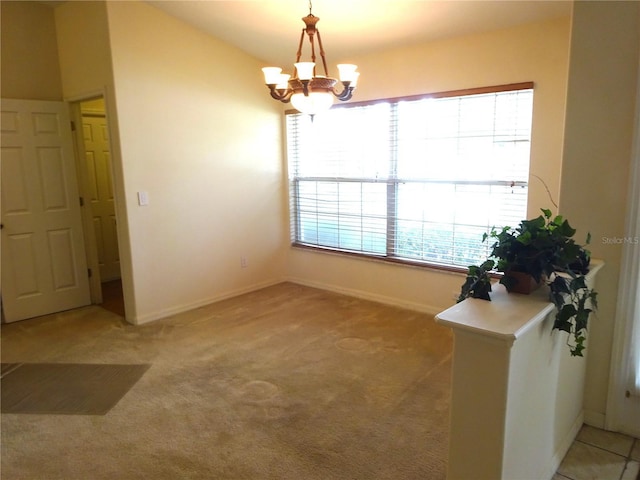 721 Willow Run St, Minneola, FL 34715 - unfurnished dining area with a chandelier, light colored carpet, and baseboards
