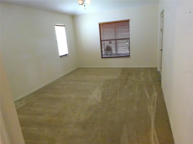 721 Willow Run St, Minneola, FL 34715 - spare room featuring baseboards and light colored carpet