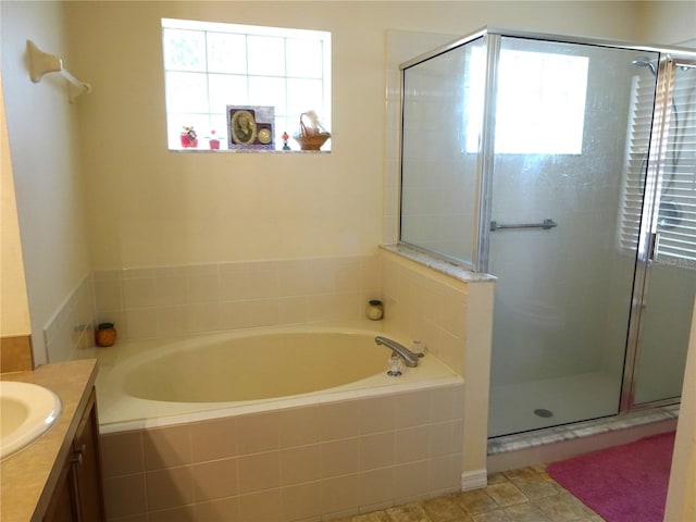 721 Willow Run St, Minneola, FL 34715 - full bath featuring vanity, a garden tub, and a stall shower