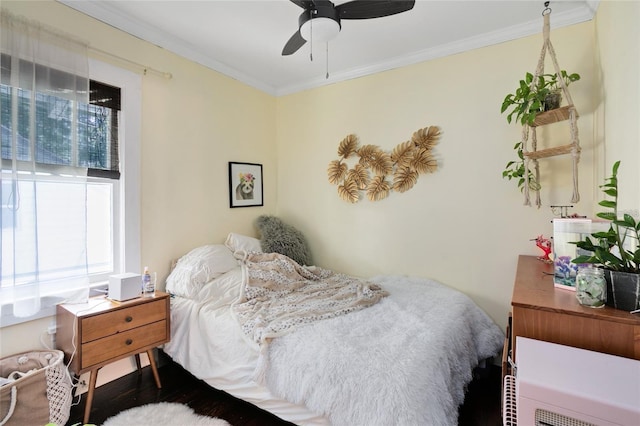 bedroom with ceiling fan, crown molding, and dark hardwood / wood-style floors