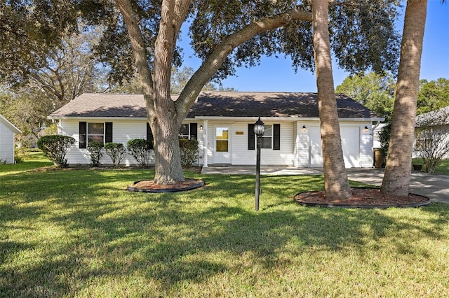 single story home featuring a front yard and a garage