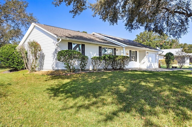 ranch-style house with a front lawn and a garage