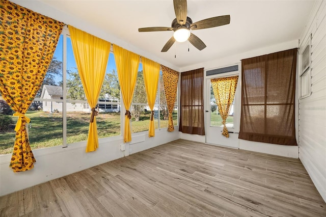 interior space featuring ceiling fan